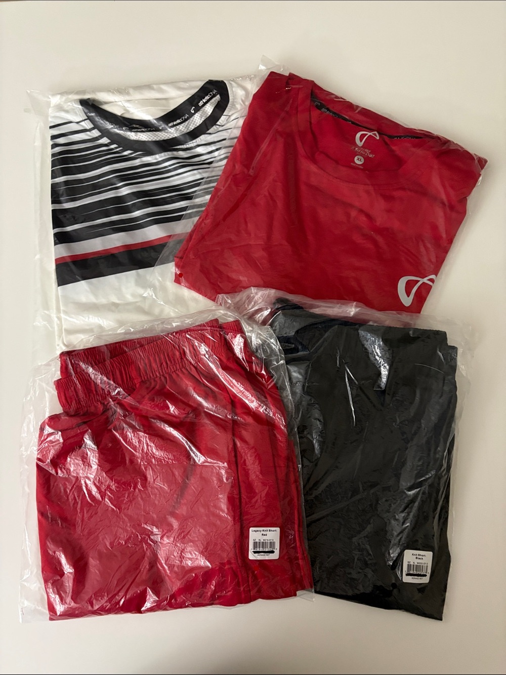 Athletic DNA Men’s XL White, Red & Black shorts (2) & shirts (2). new in plastic